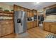 A kitchen features a stainless steel refrigerator and wooden cabinets at 2735 Peachtree Walk, Duluth, GA 30096