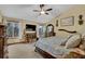 Well-lit main bedroom with plush bed, large windows, and TV at 2735 Peachtree Walk, Duluth, GA 30096