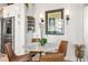 Charming dining area with seating for four, stainless appliances, and spice rack at 923 Peachtree Ne St # 939, Atlanta, GA 30309