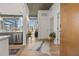 Modern condo entryway featuring hardwood floors, stylish decor, and a view of the city skyline at 923 Peachtree Ne St # 939, Atlanta, GA 30309