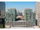 High-rise building with an outdoor swimming pool with skyline views on a bright sunny day at 923 Peachtree Ne St # 939, Atlanta, GA 30309