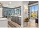 Kitchen featuring modern cabinetry, stainless steel appliances, and expansive windows with city views at 923 Peachtree Ne St # 939, Atlanta, GA 30309