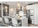 Bright kitchen features quartz counters, steel appliances, and counter seating at the island at 923 Peachtree Ne St # 939, Atlanta, GA 30309