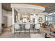 Well-appointed kitchen with a quartz breakfast bar, modern appliances, stylish pendant lighting, and elegant backsplash at 923 Peachtree Ne St # 939, Atlanta, GA 30309