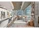 Bright open concept living room with floor to ceiling windows and concrete ceilings at 923 Peachtree Ne St # 939, Atlanta, GA 30309