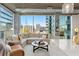 Inviting living room with large windows offering panoramic city views and plenty of natural light at 923 Peachtree Ne St # 939, Atlanta, GA 30309