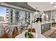 Bright living space that combines kitchen, dining, and living areas, with floor to ceiling windows at 923 Peachtree Ne St # 939, Atlanta, GA 30309