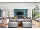 Inviting common room with plush seating, a TV, and built-in bookcases at 923 Peachtree Ne St # 939, Atlanta, GA 30309