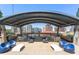 Stunning outdoor kitchen with stainless steel grills, ample counter space, and comfortable seating with city views at 923 Peachtree Ne St # 939, Atlanta, GA 30309