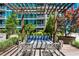 Relaxing outdoor patio showcasing comfortable seating, a fire pit, lush greenery, and scenic views at 923 Peachtree Ne St # 939, Atlanta, GA 30309