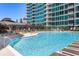 Inviting outdoor pool surrounded by lounge chairs, ideal for enjoying a relaxing swim at 923 Peachtree Ne St # 939, Atlanta, GA 30309