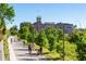 A vibrant public park with tree-lined paths, people enjoying outdoor activities and a renovated historic building in the background at 923 Peachtree Ne St # 939, Atlanta, GA 30309
