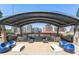 Luxury rooftop deck featuring lounge seating, built-in BBQ, and stunning city views at 923 Peachtree Ne St # 939, Atlanta, GA 30309