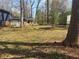 Backyard showing surrounding homes and wooded area at 2943 E Howell Dr, Lawrenceville, GA 30044