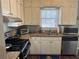 View of the kitchen with stainless steel appliances and neutral cabinets, as well as granite counters at 2943 E Howell Dr, Lawrenceville, GA 30044
