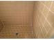 Fully tiled shower with small tan tiles, including a hexagonal tile pattern on the shower floor at 2943 E Howell Dr, Lawrenceville, GA 30044