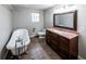 Bathroom featuring a standalone tub with chrome hardware and wood vanity with granite counters at 6225 Pebble Dr, Douglasville, GA 30135