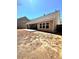 Newly built home featuring a back patio and a seeded backyard lawn at 779 Harvest Brook Dr, Lawrenceville, GA 30043