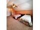 Spacious bedroom featuring two beds, ceiling fan and large bright window at 779 Harvest Brook Dr, Lawrenceville, GA 30043