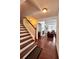 Inviting foyer with hardwood floors leads to a living space with a fireplace at 779 Harvest Brook Dr, Lawrenceville, GA 30043