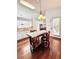 Kitchen with a granite topped island, pendant lighting, stainless steel appliances and hardwood floors at 779 Harvest Brook Dr, Lawrenceville, GA 30043