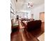 Bright living room featuring hardwood floors, white paint, and neutral decor at 779 Harvest Brook Dr, Lawrenceville, GA 30043