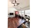 Living room space featuring hardwood floors and natural lighting through the windows at 779 Harvest Brook Dr, Lawrenceville, GA 30043