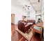 Bright living room with hardwood floors, fireplace, and comfortable seating area at 779 Harvest Brook Dr, Lawrenceville, GA 30043