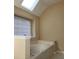 Bright bathroom with a skylight and a soaking tub for a relaxing bathing experience at , Stone Mountain, GA 30087