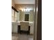 Bathroom vanity with a double sink and a mirror. Neutral paint and tile flooring at , Stone Mountain, GA 30087