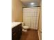 A well lit bathroom features a modern vanity and patterned shower curtain at , Stone Mountain, GA 30087