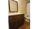 Modern bathroom features a dark vanity, a toilet, and a shower curtain for privacy at , Stone Mountain, GA 30087