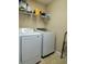 Functional laundry room with newer washer and dryer and wire shelving for storing all your laundry supplies at , Stone Mountain, GA 30087