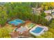 Community aerial view with tennis courts, basketball court, pool, and clubhouse at 1100 Muirfield Ct, Alpharetta, GA 30005