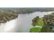 Scenic aerial view of lake and golf course offers a glimpse of luxury living at 1100 Muirfield Ct, Alpharetta, GA 30005