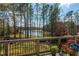 Scenic view from the deck overlooking the backyard and lake at 1100 Muirfield Ct, Alpharetta, GA 30005