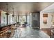 An elegant home bar, living area, and wine rack create an inviting space for relaxation and entertaining guests at 1100 Muirfield Ct, Alpharetta, GA 30005