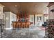 Basement featuring a bar, detailed ceiling, and wine storage at 1100 Muirfield Ct, Alpharetta, GA 30005