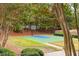 Inviting community with basketball court, lush landscaping and mature trees at 1100 Muirfield Ct, Alpharetta, GA 30005