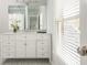 Bathroom featuring a white vanity, marble countertop, and mosaic tile flooring at 1100 Muirfield Ct, Alpharetta, GA 30005