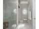 Bathroom featuring a glass shower, unique lighting, and decorative windows, enhancing the spa-like feel at 1100 Muirfield Ct, Alpharetta, GA 30005