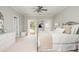 Bright bedroom with neutral decor, balcony access, and a large dresser at 1100 Muirfield Ct, Alpharetta, GA 30005