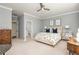 Comfortable bedroom with elegant furnishings, soft lighting, and access to an en-suite bathroom at 1100 Muirfield Ct, Alpharetta, GA 30005
