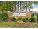 Stone entrance to the Northshore and The Peninsula Golf Club community in a wooded area at 1100 Muirfield Ct, Alpharetta, GA 30005