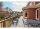 Outdoor deck and brick exterior offer a perfect blend of indoor-outdoor living and beautiful views for entertaining and relaxation at 1100 Muirfield Ct, Alpharetta, GA 30005
