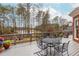 Inviting outdoor deck with lake views and outdoor seating offers a relaxing space for entertaining and enjoying the scenery at 1100 Muirfield Ct, Alpharetta, GA 30005