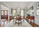 Elegant dining room boasts a chandelier, hardwood floors, and decor throughout at 1100 Muirfield Ct, Alpharetta, GA 30005