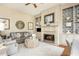 Cozy living room with fireplace, custom built-ins, and stylish decor at 1100 Muirfield Ct, Alpharetta, GA 30005