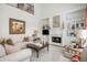 Elegant living room with fireplace, built-in bookshelves, and stylish decor creating a warm and inviting atmosphere at 1100 Muirfield Ct, Alpharetta, GA 30005