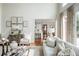 Comfortable living room featuring stylish furniture, decor, and an open view to the kitchen at 1100 Muirfield Ct, Alpharetta, GA 30005